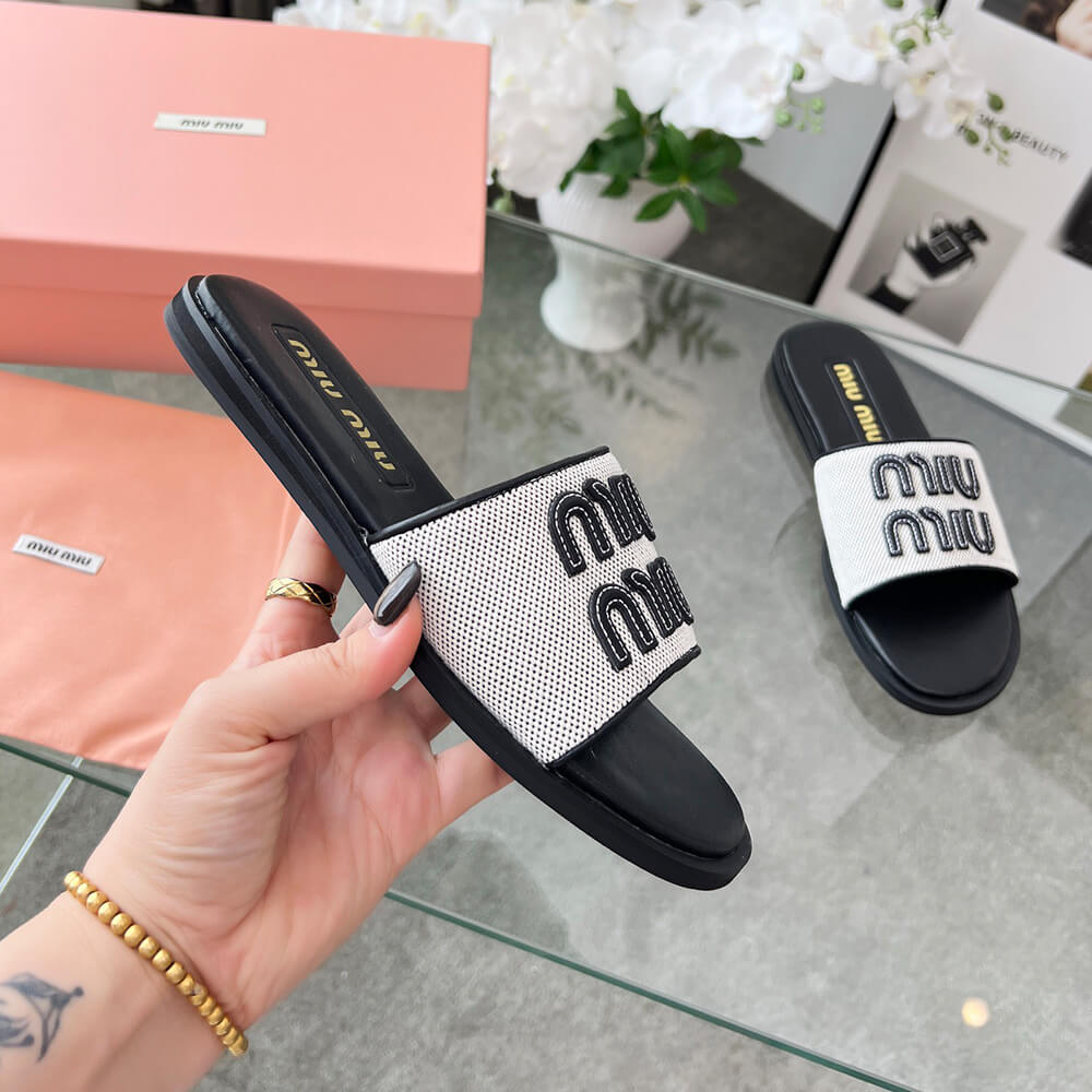 MiuMiu Canvas and leather slides